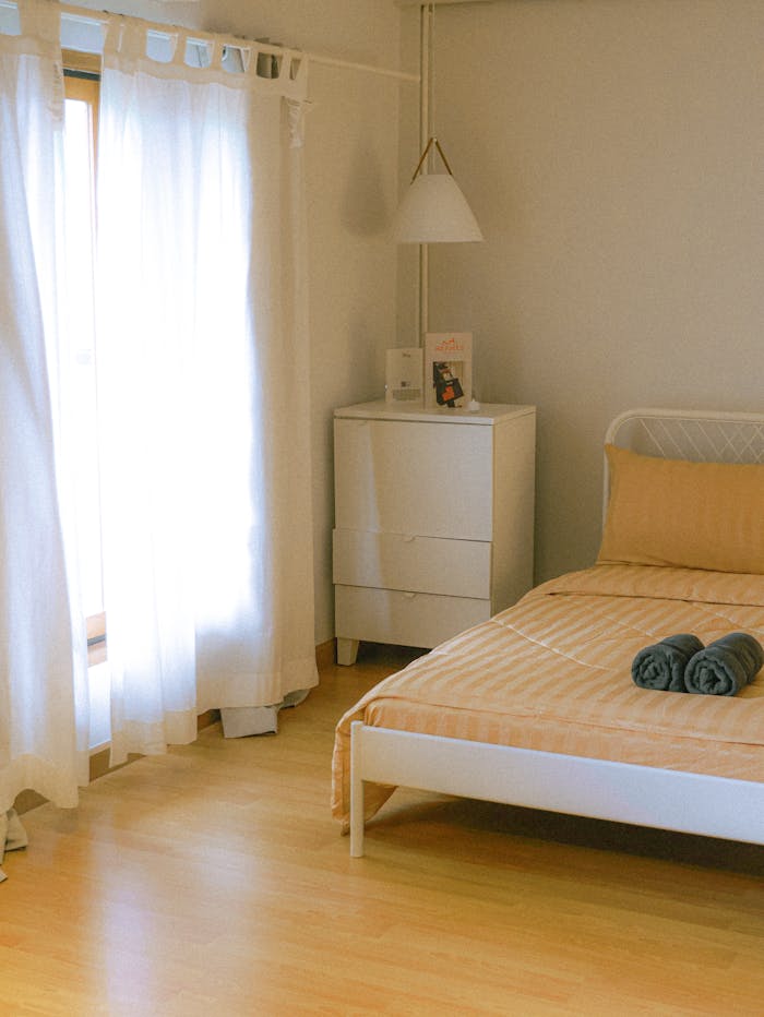 pexels photo 27313198 1 Bright minimalist bedroom interior with natural lighting in Bangkok, Thailand.